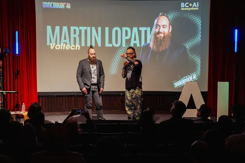 A speaker introduction onstage with the audience in view.