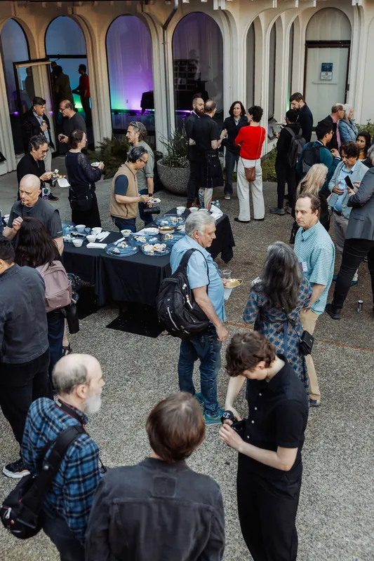 Attendees filling the courtyard before moving into the theatre.