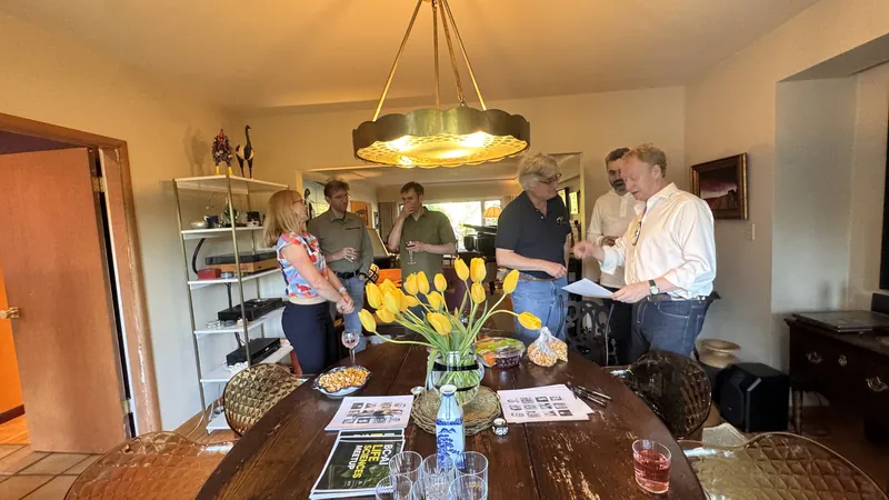The first Life Sciences supper around the dining table, yellow tulips in the middle.