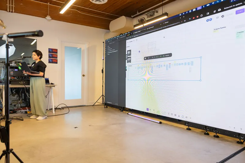 Live laptop demo setup and projected interface walkthrough, photo 106.