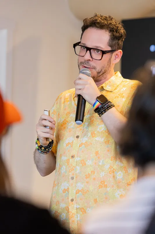 Presenter explaining a personhood slide and related technical details, photo 060.