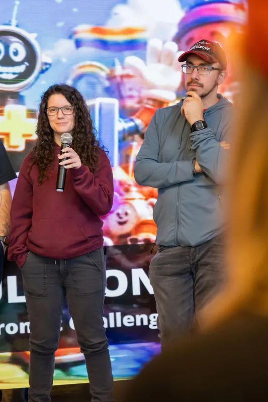 Group showcase segment with participants taking turns at the microphone, photo 132.