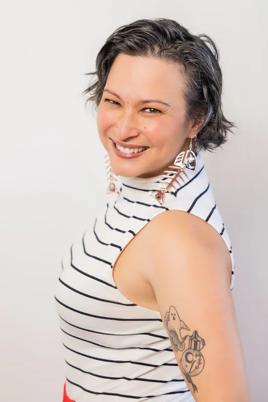 Side-angle Film Club pre-event portrait with geometric earrings, photo 005.