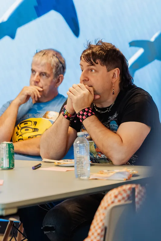 Participants listen and react during the workshop, photo 048.