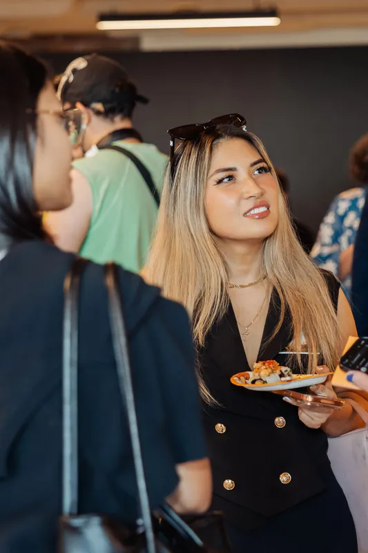 Film Club attendees connect over refreshments during arrivals, photo 006.