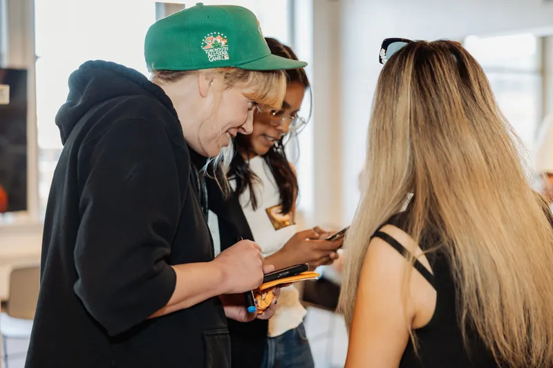 Film Club attendees connect over refreshments during arrivals, photo 002.