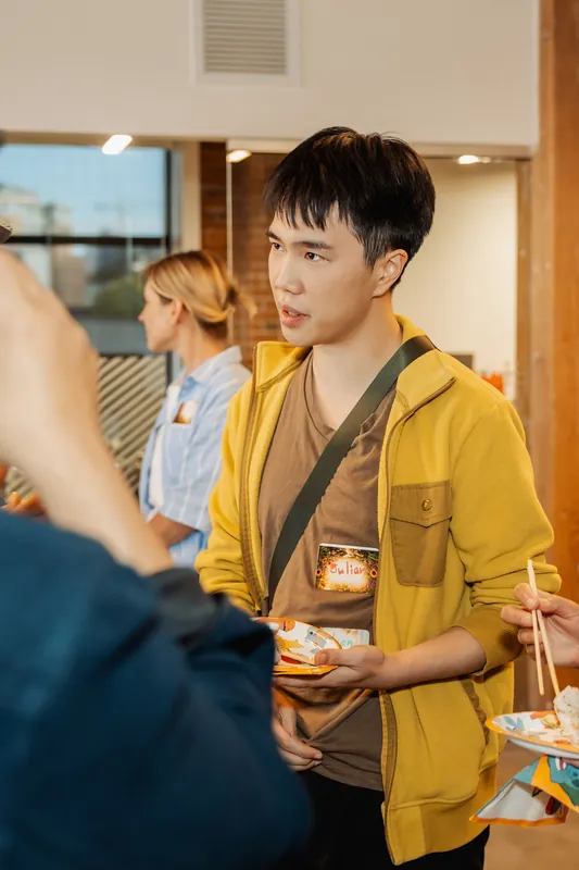 Film Club attendees connect over refreshments during arrivals, photo 001.