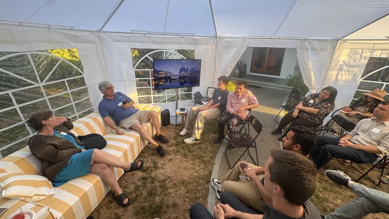 Sofa-side conversation in the tent after a talk.