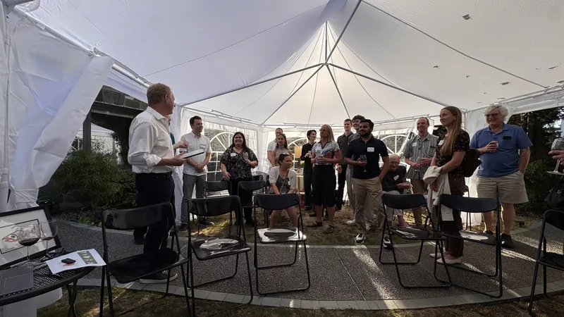 A wider view of conversation inside the backyard tent.