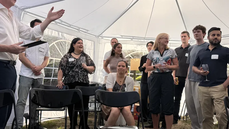 The backyard tent filling as the August 11 Life Sciences gathering gets underway.