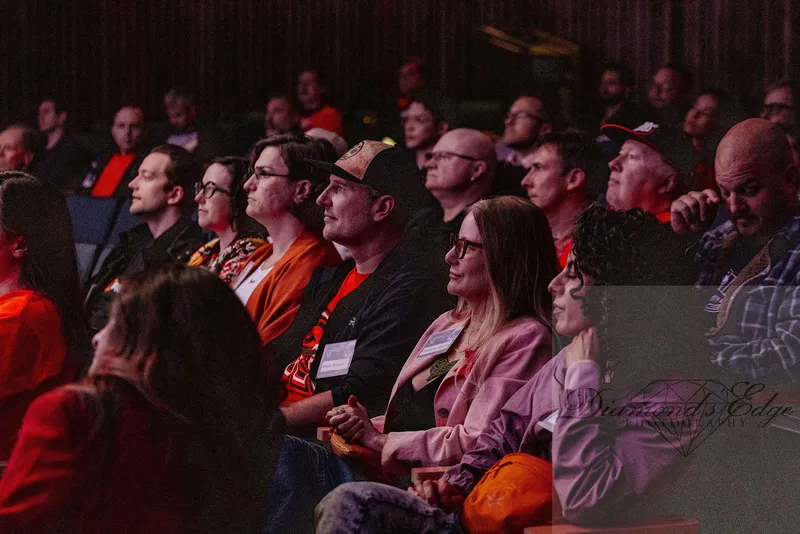 The audience listening in the theatre. Photograph by Michelle Diamond, September 30, 2026.