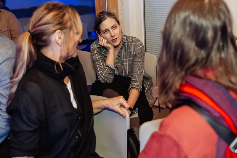 Small-group conversation during the opening social time.