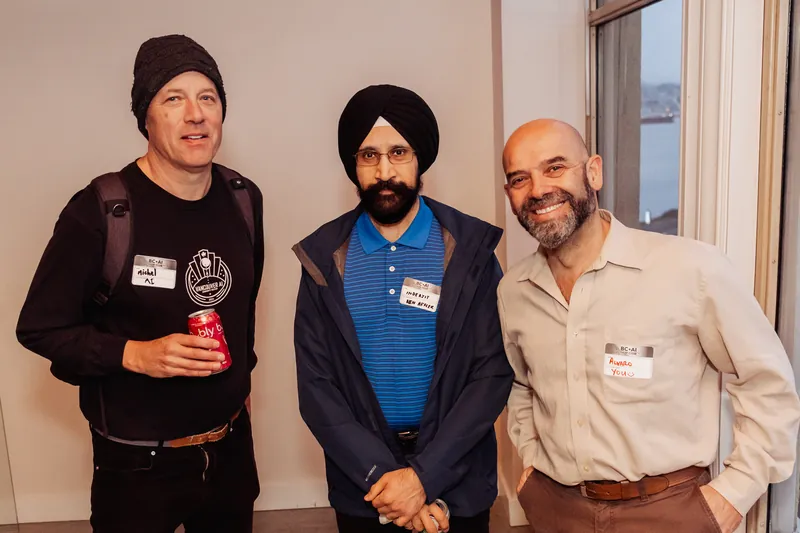 Three community members posing together before the program.