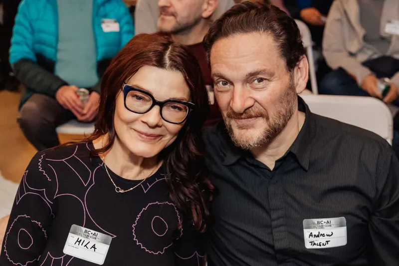 Two attendees seated together during the March Film Club night.