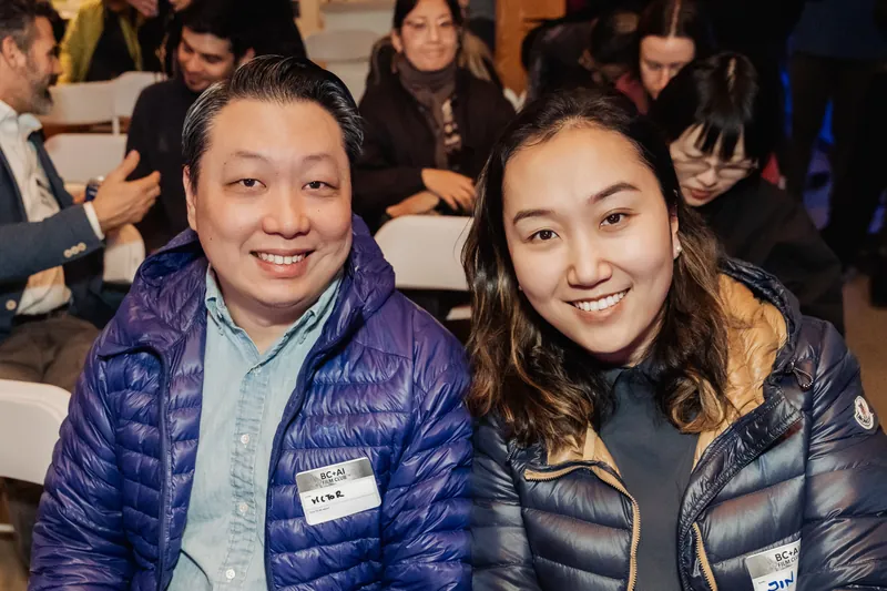 Two Film Club attendees seated together before the screening block.