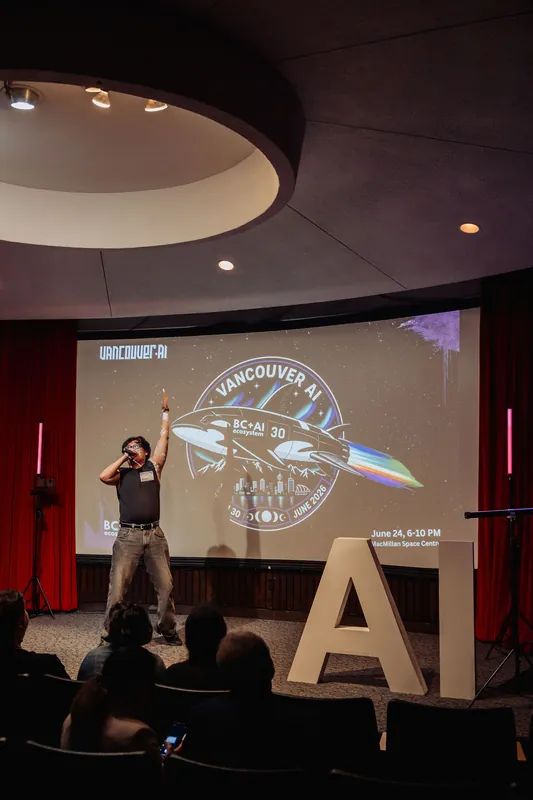 The circular planetarium ceiling frames the performer on stage as the seated audience takes in the show.