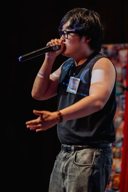 Full-length view of the performer delivering an expressive set on the Space Centre stage.