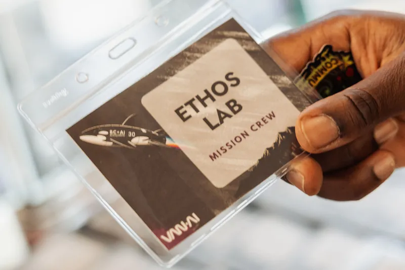 Every attendee got an 'Ethos Lab — Mission Crew' badge, leaning into the night's space-mission theme.