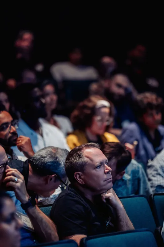 Rows of attendees sit in close attention during the talks program inside the Space Centre planetarium.