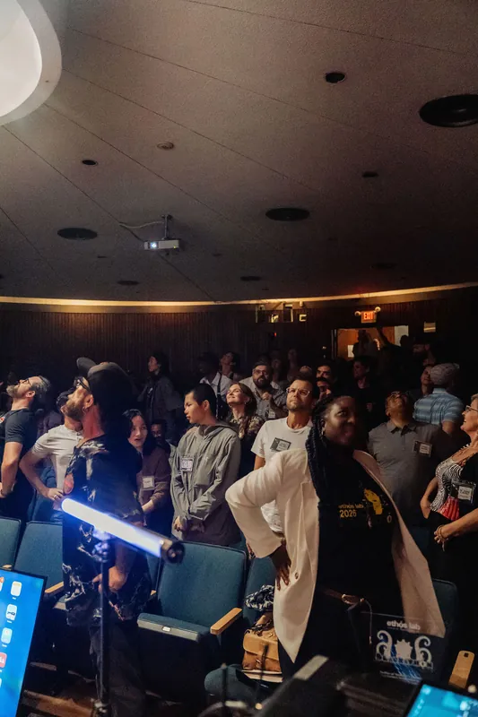 The full audience stands transfixed as an LED light-wand performance commands the Space Centre floor.