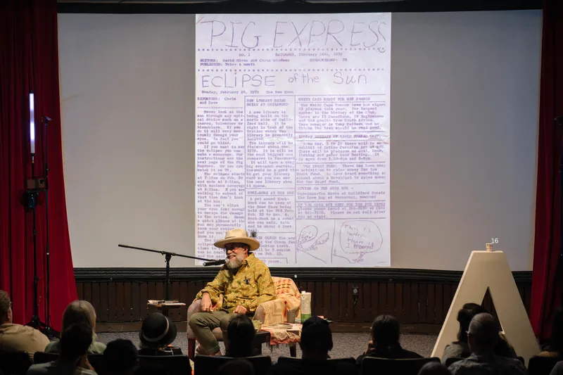 Dave Olson's slides dig into library work, notebooks, and found objects — Stage-left view.