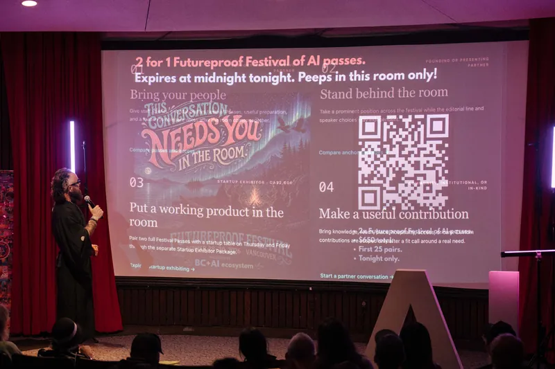 A Futureproof Festival QR code slide invites the room to plug in.