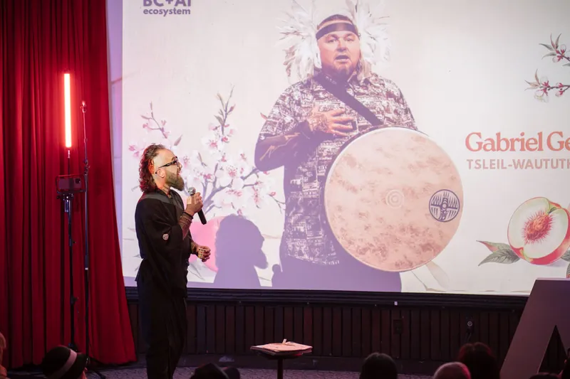 Opening performers take the stage under the Vancouver AI Community title slide — Stage-right view.