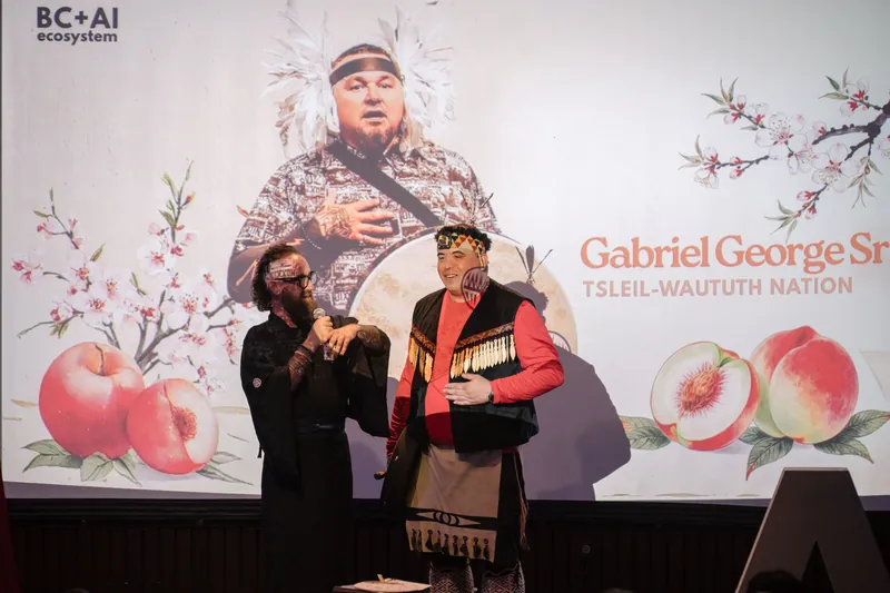 Opening performers take the stage under the Vancouver AI Community title slide — Closer on the mic.