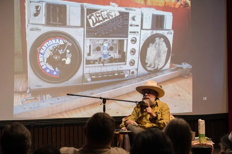 A vintage boombox graphic lands in the middle of Dave Olson's talk.