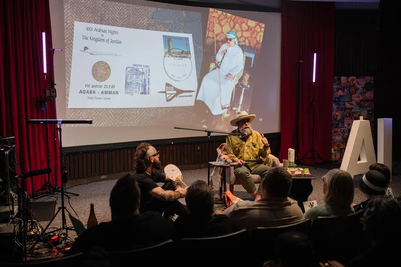 An on-stage conversation with Dave Olson — two chairs, mic, and a listening room — Wider angle.