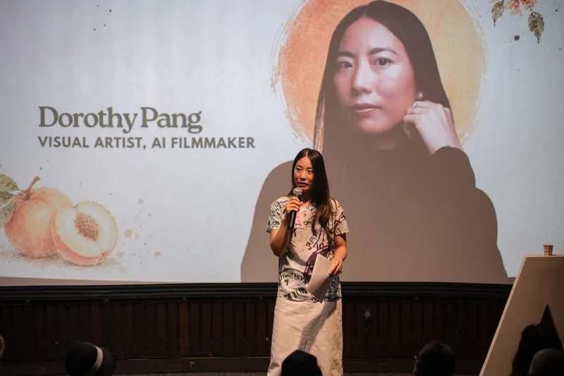 Dorothy Pang presents from the mic under her peach-illustrated intro slide — From the aisle.