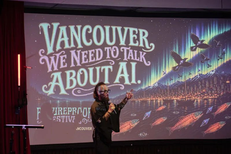 Kris presents a Futureproof slide: "Vancouver — WE NEED TO TALK ABOUT AI," with salmon and city artwork.