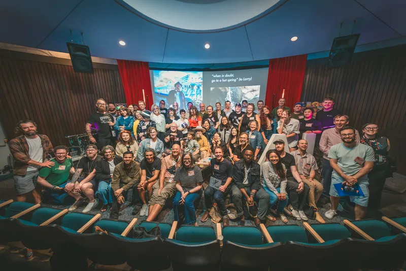 The full room gathers on stage for Meetup #31's closing group photo.