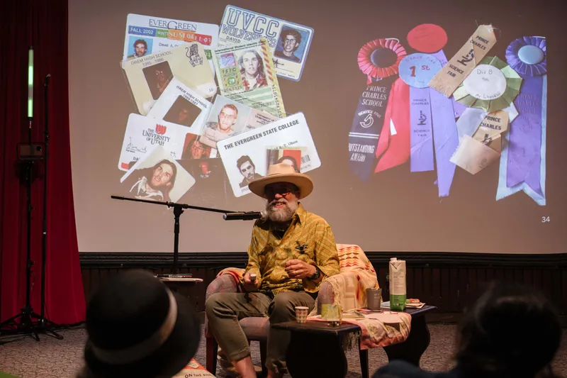 Dave Olson continues from the armchair as denser text and photo slides roll.
