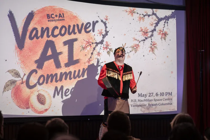 An Indigenous welcome unfolds on stage as the audience settles in — Stage-left view.