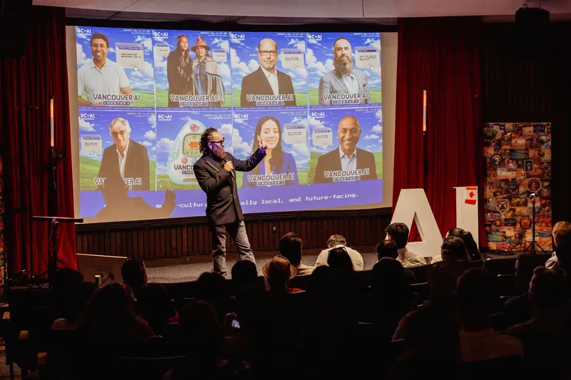 The event host welcomes a seated audience beneath a Vancouver AI Meetup speaker collage.