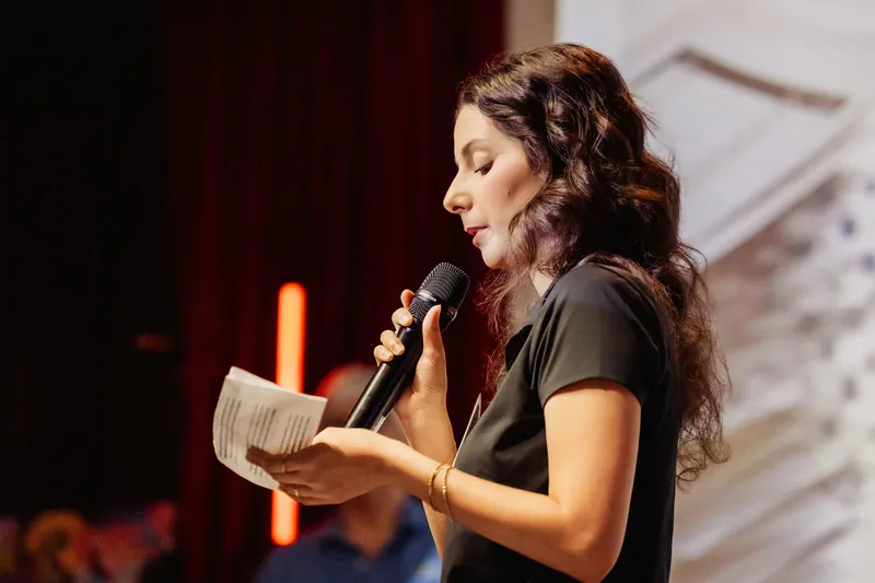 A close portrait shows a Data for Good representative speaking onstage.