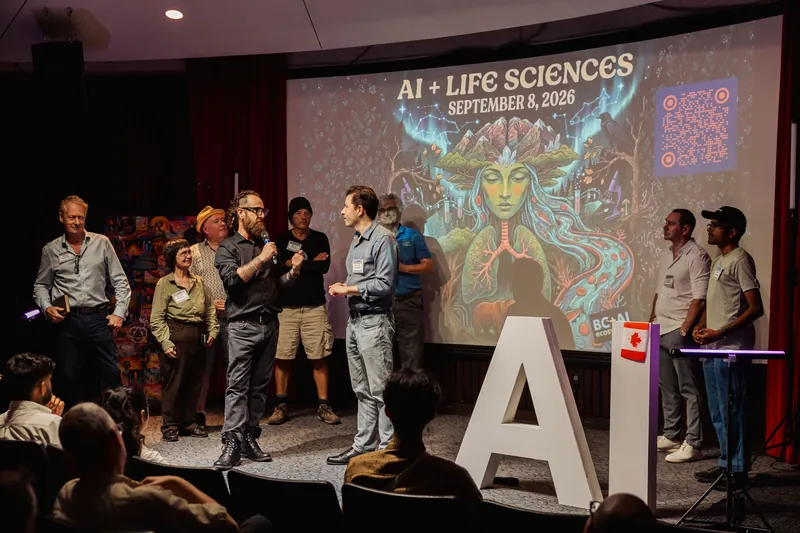 AI + Life Sciences representatives gather beneath a slide for their September event.