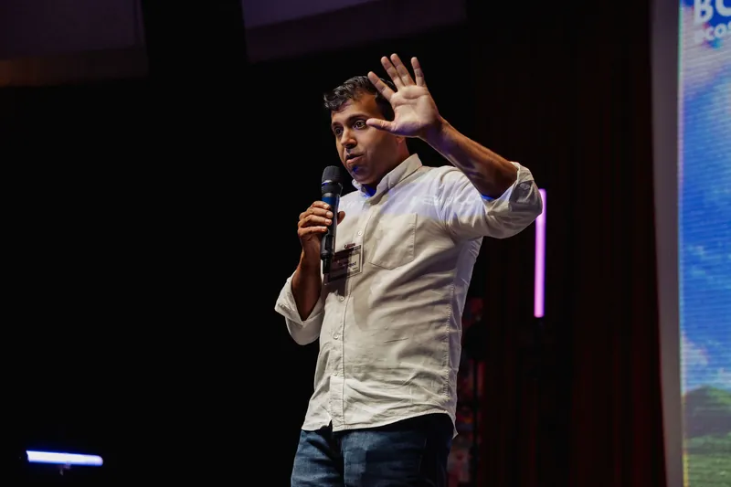 Taleeb Noormohamed holds one hand beside his head during an emphatic moment.