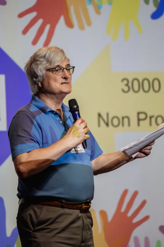 A close portrait shows a Data for Good presenter speaking into a microphone.