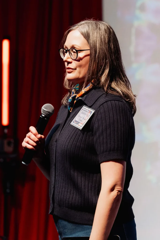 Andrea Mills speaking at Vancouver AI in May 2026.